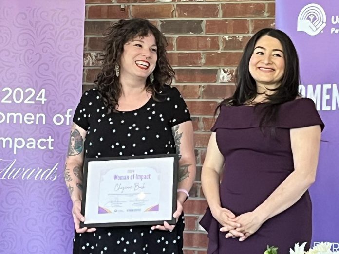 One City Peterborough's drop-in program coordinator Cheyenne Buck (left, pictured with Maryam Monsef), who was one of 20 local women who received a Women of Impact award from the United Way Peterborough & District in May 2024, is also being honoured with a Rebel with a Cause award from the Elizabeth Fry Society of Peterborough, along with Kelli Marshall and Jocelyn Enright, at a fundraising event at Showplace Performance Centre in downtown Peterborough on November 27, 2024. (Photo: United Way Peterborough & District)