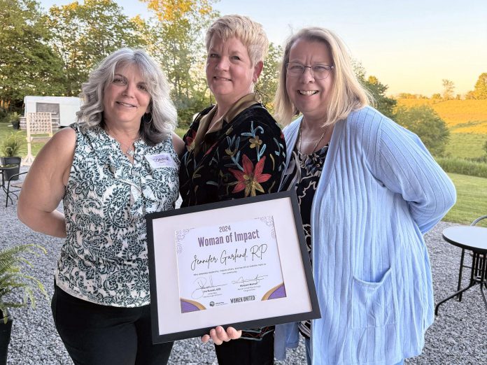 The Mane Intent founder Jennifer Garland, RP, holding her 2024 Woman of Impact Award from the United Way Peterborough & District, with Clinical Psychologist Constance Oates and the former Kawartha Sexual Assault Centre Executive Director Sonya Vellenga. (Photo courtesy of The Mane Intent)