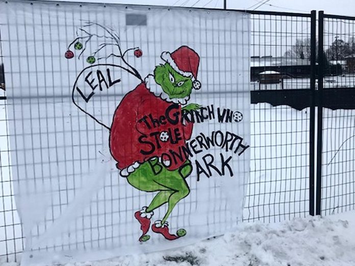 A sign placed on a fence surrounding Bonnerworth Park in Peterborough. (Photo: John Gerelus)