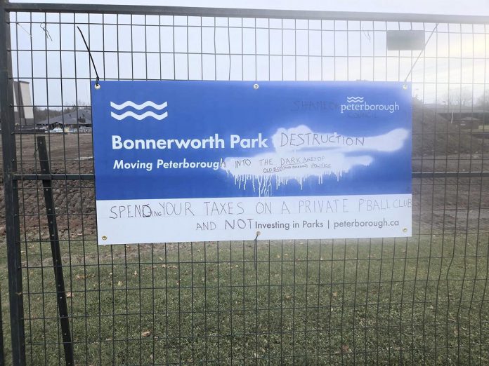 A vandalized City of Peterborough sign promoting the Bonnerworth Park redevelopment project. (Photo: Sam Brown / Save Bonnerworth Park Facebook Group)