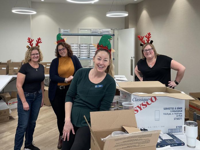 Community Care Peterborough staff members helping with the charitable organization's Meals to Go fundraiser on December 3, 2024. A total of 634 meals were donated for seniors and adults living with physical challenges throughout Peterborough and surrounding areas in December. (Photo courtesy of Community Care Peterborough)