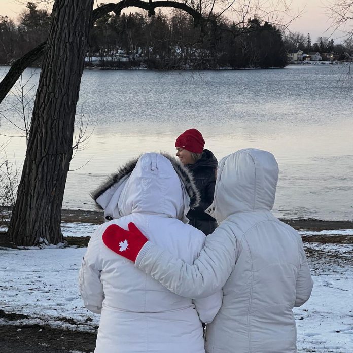 Two attendees at a Darkness to Light gathering in Peterborough's Rogers Cove listen as registered psychotherapist Julie Brown leads the event. (Photo: Hospice Peterborough / Facebook)