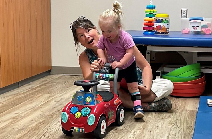 Five Counties Children's Centre speech language pathologist Kate helps client Nova in formulating her words, even as she helps steer Nova in the right direction during a recent treatment session. While Five Counties doesn't actually use a "smiles index" to measure success, the smiles of clients receiving treatment at the centre help staff gauge how well they are doing in supporting kids and their families. (Photo courtesy of Five Counties Children's Centre)