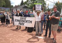 More than 250 people attended a "Save Bonnerworth Park" rally on May 18, 2024 at the park at McDonnel Street and Monaghan Road where the City of Peterborough approved a $4.1-million redevelopment project that includes 14 pickleball courts, an expanded skate park, a bike pump track, and a parking lot. (kawarthaNOW screenshot of Mark Wollard video)