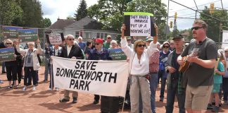 More than 250 people attended a "Save Bonnerworth Park" rally on May 18, 2024 at the park at McDonnel Street and Monaghan Road where the City of Peterborough approved a $4.1-million redevelopment project that includes 14 pickleball courts, an expanded skate park, a bike pump track, and a parking lot. (kawarthaNOW screenshot of Mark Wollard video)