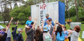 Excited children at the 2024 Peterborough Children's Water Festival volunteer for an opportunity to experience the "Lather Up" activity centre, which teaches students how they and their families can conserve water when showering. The festival is an annual event at the Riverview Park & Zoo that combines education, fun, and hands-on learning to teach children about the importance of water in their lives, empowering them to take action in their homes and communities to conserve and protect water. (Photo: Karen Halley)