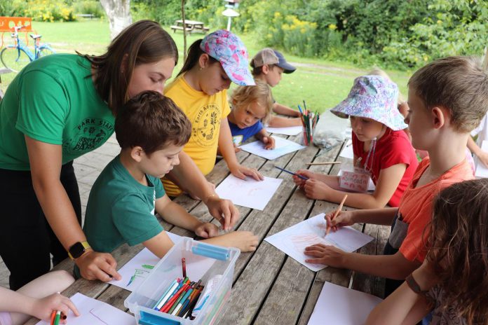 GreenUP is a not-for-profit environmental organization that works to promote sustainability, green living, and environmental education in Peterborough and the Kawarthas. Pictured is Parys Carr facilitating a group of children during an Earth Adventures Summer Camp at GreenUP's Ecology Park. The charity, which is facing unprecedented financial challenges that are putting some of its programs at risk, is seeking increased community donations. (Photo courtesy of GreenUP)