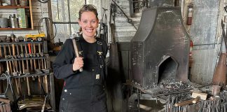 After more than 20 years as a volunteer and employee at Lang Pioneer Village Museum in Keene, museum operations coordinator Hailey Doughty discovered she is a descendent of Daniel Kidd, the blacksmith who worked in and built the blacksmith shop currently at the living history museum. The discovery inspired Doughty to take a blacksmith workshop alongside her father, which has ignited a new passion for the trade among the family's current generation. (Photo courtesy of Hailey Doughty)