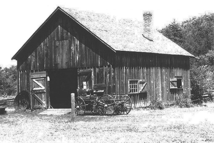 Lang Pioneer Village Museum's blacksmith shop in 1969, two years after the living history museum opened. The shop was moved from Warsaw where it was originally built in 1859 by blacksmith Daniel Kidd, who is Hailey Doughty's four-times great uncle. (Photo courtesy of Hailey Doughty)