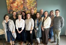 The senior leadership team of Peterborough Public Health and the Haliburton, Kawartha, Pine Ridge District Health Unit, including medical officers of health Dr. Thomas Piggot (front row, right) and Dr. Natalie Bocking (back row, left). The two health units have merged under the legal name Haliburton Kawartha Northumberland Peterborough Health Unit, bringing together over 300 public health professionals under a single entity. The first meeting of the new board of health for the merged health unit will be held virtually on January 2, 2025. (Photo: Haliburton Kawartha Northumberland Peterborough Health Unit)