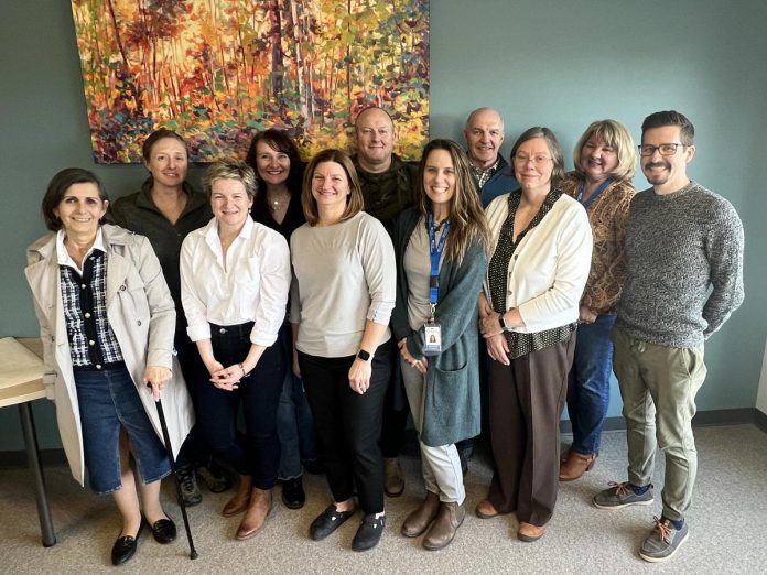 The senior leadership team of Peterborough Public Health and the Haliburton, Kawartha, Pine Ridge District Health Unit, including medical officers of health Dr. Thomas Piggot (front row, right) and Dr. Natalie Bocking (back row, left). The two health units have merged under the legal name Haliburton Kawartha Northumberland Peterborough Health Unit, bringing together over 300 public health professionals under a single entity. The first meeting of the new board of health for the merged health unit will be held virtually on January 2, 2025. (Photo: Haliburton Kawartha Northumberland Peterborough Health Unit)