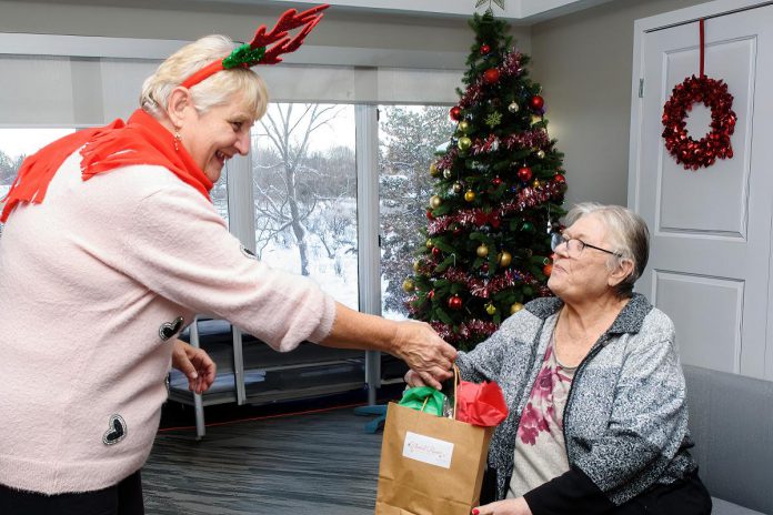 Lindsay Garden Club volunteers recently delivered more than 700 brightly coloured Kalanchoe plants, along with Christmas cards created by area schoolchildren, to residents of Kawartha Lakes long-term care homes. (Photo courtesy of Lindsay Garden Club)