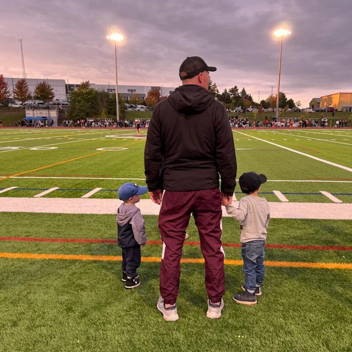 Nick Beamish, a teacher and coach at St. Peter Catholic Secondary School in Peterborough, with his sons Luke and Sam. In 2018, before he was a father, Beamish experienced a cardiac emergency and had to spend his Christmas at Kingston General Hospital away from home, because Peterborough Regional Health Centre (PRHC) did not have the facilities to assess and diagnose his condition. Today, he says he "couldn't imagine" being away from his sons to receive cardiac care and is encouraging donations to the PRHC Foundation's $60-million Campaign for PRHC so the hospital can introduce an electrophysiology lab to support patients with abnormal heart rhythms or arrhythmia.  (Photo courtesy of PRHC Foundation) 