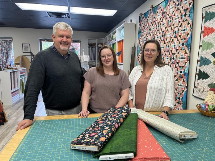 Tim, Jocelyn, and Sheila Shauf at Sheila and Jocelyn's quilt store Quiltiful in Bobcaygeon. The Shauf family is sharing Jocelyn's cancer journey as part of the Ross Memorial Hospital (RMH) Foundation's 2024 "Hopeful Moments" holiday appeal in support of the Lindsay hospital. (Photo courtesy of RMH Foundation)