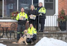 Through sales of the 2025 Paramedic Therapy Dog Calendar fundraiser featuring the Northumberland Paramedics therapy dog Ivy Joules (front), Northumberland Paramedics raised over $1,000 to deliver over 50 holiday meals to seniors and community members in need this winter. Pictured from left to right are Northumberland paramedic Joe Glass, Ketch's Korner owner Melissa Dale, Northumberland Paramedics Chief Susan Brown, and (with Ivy Joules) Northumberland Paramedics superintendent of quality improvement education Giselle Lech. (Photo: Northumberland County)