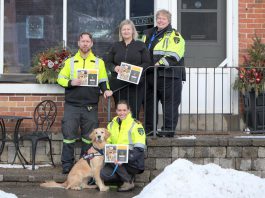 Through sales of the 2025 Paramedic Therapy Dog Calendar fundraiser featuring the Northumberland Paramedics therapy dog Ivy Joules (front), Northumberland Paramedics raised over $1,000 to deliver over 50 holiday meals to seniors and community members in need this winter. Pictured from left to right are Northumberland paramedic Joe Glass, Ketch's Korner owner Melissa Dale, Northumberland Paramedics Chief Susan Brown, and (with Ivy Joules) Northumberland Paramedics superintendent of quality improvement education Giselle Lech. (Photo: Northumberland County)