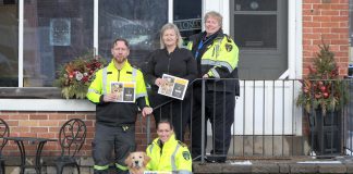 Through sales of the 2025 Paramedic Therapy Dog Calendar fundraiser featuring the Northumberland Paramedics therapy dog Ivy Joules (front), Northumberland Paramedics raised over $1,000 to deliver over 50 holiday meals to seniors and community members in need this winter. Pictured from left to right are Northumberland paramedic Joe Glass, Ketch's Korner owner Melissa Dale, Northumberland Paramedics Chief Susan Brown, and (with Ivy Joules) Northumberland Paramedics superintendent of quality improvement education Giselle Lech. (Photo: Northumberland County)