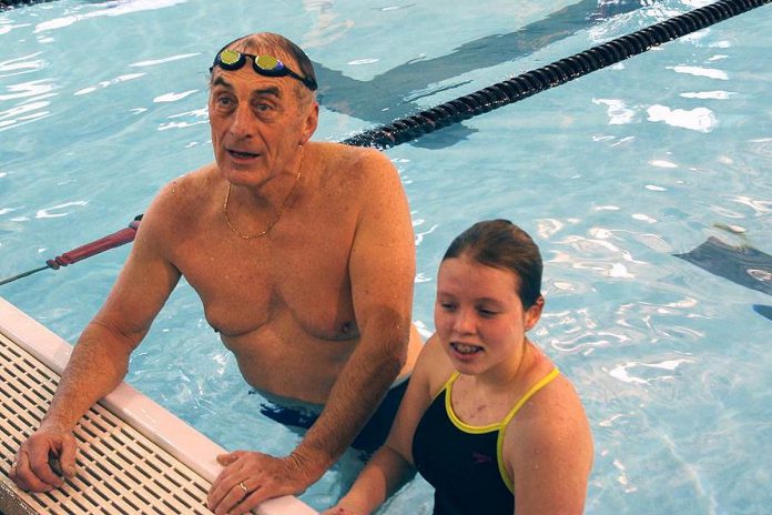 Carl Oake with Annaleise Carr in 2013 during the annual swimathon that he founded in 1987 and which has since raised more than $1.4 million to support Easter Seals Ontario and local Rotary projects. Oake, who passed away on January 2, 2025 at the age of 79, will be honoured during the January 6 media launch for the 39th annual Carl Oake Rotary Swim, which takes place on February 28. (Photo: Stephen Vass)