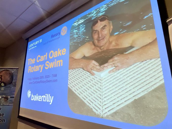 The late Carl Oake was remembered at the media launch of the 39th annual Carl Oake Rotary Swim at the offices of Baker Tilly KDN LLP in downtown Peterborough on January 6, 2025. The founder of the fundraiser for Easter Seals and projects supported by the Rotary Club of Peterborough, which takes place this year on February 28 at the Peterborough YMCA, passed away on January 2 at the age of 79. (Photo: Paul Rellinger / kawarthaNOW)