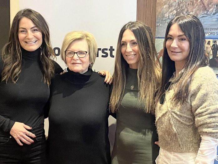 The late Carl Oake's wife and his three daughters attended the media launch of the 39th annual Carl Oake Rotary Swim at the offices of Baker Tilly KDN LLP in downtown Peterborough on January 6, 2025. Pictured from left to right are Renée Oake, Tana Oake, Vanessa Oake Hogan, and Lesley Oake. (Photo: Paul Rellinger / kawarthaNOW)