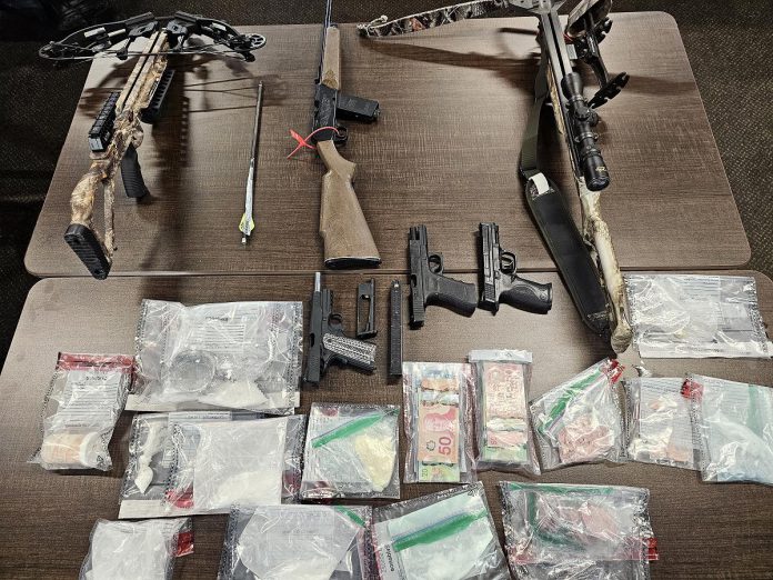 Drugs, weapons, and cash seized after search warrants were executed on January 30, 2025, after an investigation into illegal drug activity at 351 and 353 John Street in the Town of Cobourg. (Photo: Cobourg Police Service)