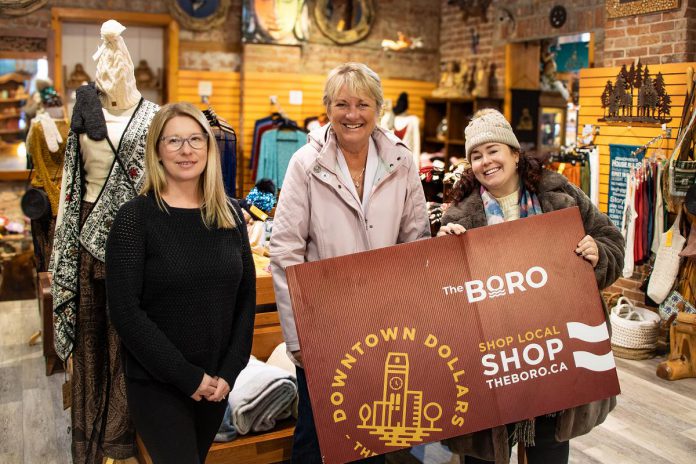 Michelle Cardwell (middle) was the grand prize winner of a $1,500 Boro gift card in the annual Holiday Shopping Passport program organized by Peterborough Downtown Business Improvement Area (DBIA). Also pictured is Tribal Voices manager Amanda Clarkson (left) and Peterborough DBIA marketing and communications manager Amanda Bedford. Tribal Voices was one of the downtown Peterborough businesses where Cardwell shopped to complete her winning Holiday Shopping Passport. (Photo courtesy Peterborough DBIA)