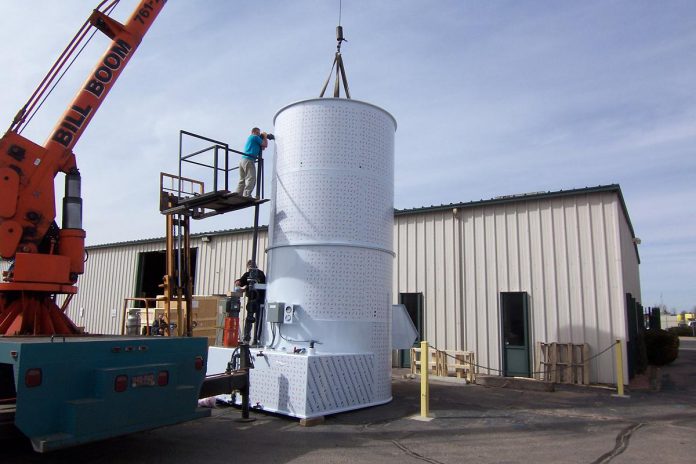 As a custom fabricator, GreenUp executive director Tegan Moss's father Ric Moss built equipment like the large plastic water scrubber, pictured here as it was assembled outside of TFI Inline in Lakewood, Colorado. Plastic pollution control equipment like this will work for decades without corrosion. (Photo: Ric Moss)