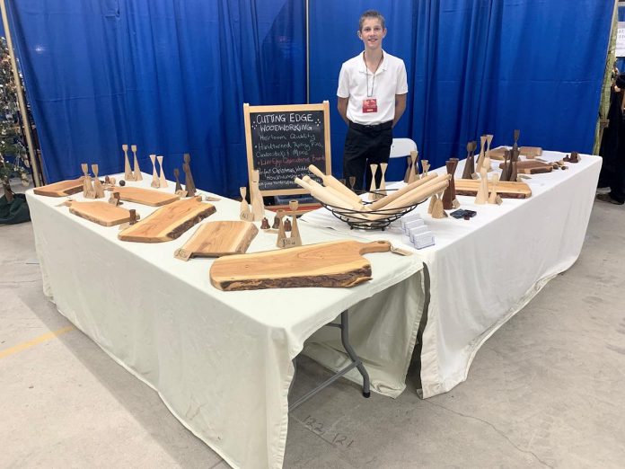 Isaiah Jalsevac selling his hand-turned rolling pins, candlesticks, platters, bowls, and spin tops at the 2024 Hand of Man Art and Craft Sale in Peterborough. The 15-year-old Millbrook entrepreneur, who started his woodworking business Cutting Edge Woodworking when he was 11, is not only saving for his future college tuition but also funding his passion for building remote-controlled airplanes. (Photo: Cutting Edge Woodworking / Facebook)