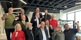 The inductees of Junior Achievement of Northern and Eastern Ontario's 10th annual Peterborough Business Hall of Fame, pictured in the lobby of the Venture North Building in downtown Peterborough on January 22, 2025, are (from left to right, bottom to top) Diane Richard, Nancy Wiskel, Matt Holmes, Michael Riseley, Kelly and Martin Carbajal, Darrell Junkin, Grant Seabrooke, Raj Patel, Micheal Eatson, Eric Eatson, Graeme Eatson, and Drew Merrett. Not pictured: Toni and Kelli Grady, Margo and Paul Hudson, and Donnell Leahy, Natalie McMaster, and Julia Leahy. (Photo courtesy of JA-NEO)