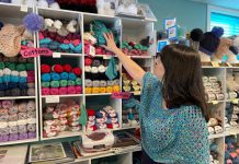 Tracy Minnema checks out the inventory at her Keene business A River of Yarn, which is celebrating its 10-year anniversary in 2025. Located at 353 Kents Bay Road on the Otonabee River, the destination yarn shop and studio offers high-quality and affordable yarn, including top brands like Schoppel Zauberperlen and Fibra Natura, and also hosts regular workshops. (Photo courtesy of A River of Yarn)