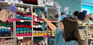 Tracy Minnema checks out the inventory at her Keene business A River of Yarn, which is celebrating its 10-year anniversary in 2025. Located at 353 Kents Bay Road on the Otonabee River, the destination yarn shop and studio offers high-quality and affordable yarn, including top brands like Schoppel Zauberperlen and Fibra Natura, and also hosts regular workshops. (Photo courtesy of A River of Yarn)