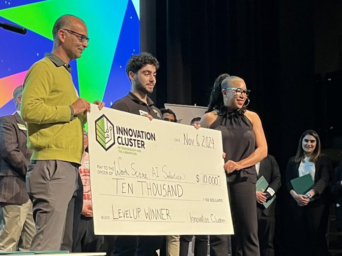 Alex Bilyan (middle), chief sales officer and co-founder of WorkScore.ai, was the winner of $10,000 at the Innovation Cluster's LevelUP Pitch Competition at Market Hall Performing Arts Centre in downtown Peterborough on November 6, 2024. Applications are open until January 15, 2025, for the third cohort of the 12-week business accelerator program that helps Ontario entrepreneurs with a minimal viable product take their business to the next level. (Photo: Innovation Cluster)