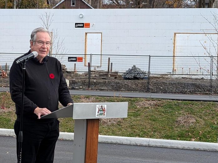 Peterborough Mayor Jeff Leal announcing the release of the 15-recommendation report of the Mayor's Task Force for Housing Creation at a media event on November 5, 2024 in front of of Ashburnham Realty's six-storey building currently under construction along the Rotary Greenway Trail just north of Robinson Street in Peterborough's East City. (Photo: Bruce Head / kawarthaNOW)