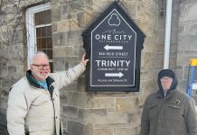 New volunteer-created signage at One City Peterborough, a non-profit charitable organization located in the former Trinity United Church at 360 Reid St. in Peterborough, where it operates the municipally funded Trinity Community Centre, a minimum-barrier space with a daytime drop-in program and overnight program for people who are marginalized or unsheltered. (Photo: One City Peterborough / Facebook)