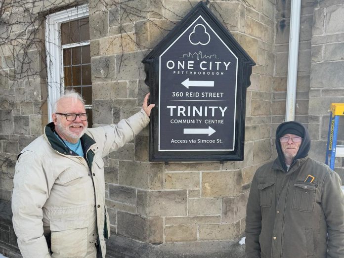 New volunteer-created signage at One City Peterborough, a non-profit charitable organization located in the former Trinity United Church at 360 Reid St. in Peterborough, where it operates the municipally funded Trinity Community Centre, a minimum-barrier space with a daytime drop-in program and overnight program for people who are marginalized or unsheltered. (Photo: One City Peterborough / Facebook)