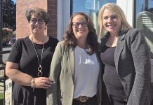 Peterborough County's economic development and tourism team (Tracie Bertrand, Rhonda Keenan, and Sarah Budd) pictured in September 2024 in front of the county's business information hub located in the former post office at 12 Queen Street in downtown Lakefield. The office serves as the central hub in a "hub and spoke" model that will provide services to businesses and residents across the county. (Photo: Peterborough County)