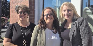 Peterborough County's economic development and tourism team (Tracie Bertrand, Rhonda Keenan, and Sarah Budd) pictured in September 2024 in front of the county's business information hub located in the former post office at 12 Queen Street in downtown Lakefield. The office serves as the central hub in a "hub and spoke" model that will provide services to businesses and residents across the county. (Photo: Peterborough County)