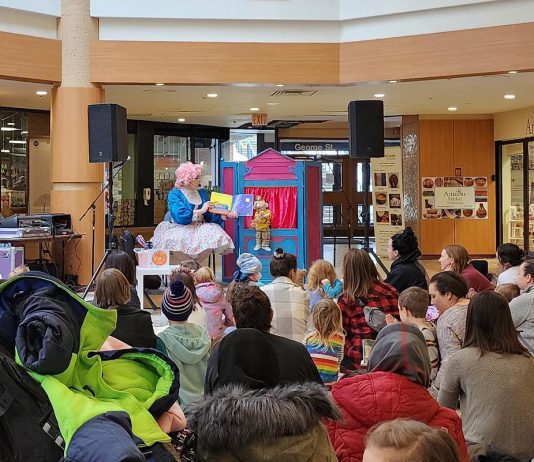 Families enjoying a reading by Betty Baker and Butch during Peterborough Family Literacy Day at Peterborough Square in January 2024. They will be returning to the free annual event at Peterborough Square on January 25, 2025. (Photo: Peterborough Family Literacy Day / Facebook)