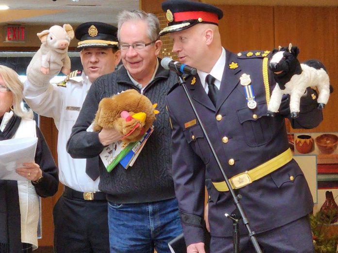 Peterborough County Warden Bonnie Clark, Peterborough Fire Services Chief Chris Snetsinger, Peterborough Mayor Jeff Leal, and Peterborough Police Service Chief Stuart Betts participating in the Readers' Theatre during Peterborough Family Literacy Day at Peterborough Square in January 2024. They will return to participate in the annual event on January 25, 2025 along with Peterborough-Kawartha MP Michelle Ferreri, Curve Lake First Nation Chief Keith Knott, and Hiawatha First Nation Chief Laurie. (Photo: Peterborough Family Literacy Day / Facebook)