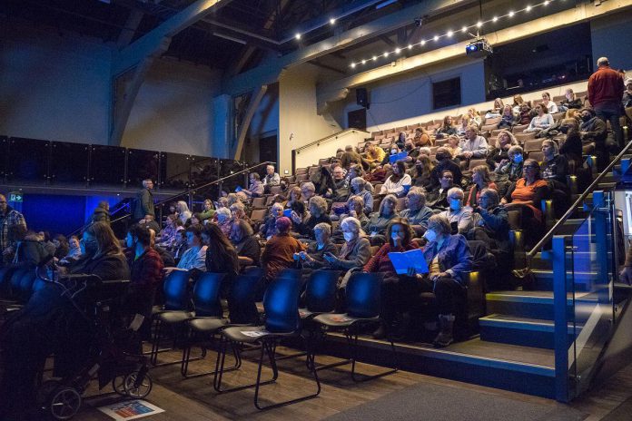 An audience at Market Hall Performing Arts Centre during the 2024 ReFrame Film Festival. To ensure the festival remains accessible to all, both screening venues in downtown Peterborough have elevators and wheelchair access. The venues will also have assisted learning devices and sensory kits available, while Showplace Performance Centre will provide access to a safe space with reduced lighting, lower volume, and a smaller screen for audiences to watch the films. (Photo: Esther Vincent, courtesy of ReFrame Film Festival)