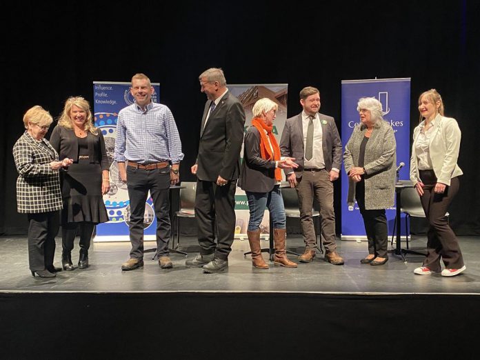 Debate organizers and three of the five provincial election candidates for Peterborough-Kawartha gather on the Market Hall stage prior to the debate on February 18, 2025. The debate was hosted by the Peterborough and Kawarthas Chamber of Commerce, Peterborough and the Kawarthas Home Builders' Association, the Central Lakes Association of Realtors, the Peterborough Downtown Business Improvement Area (DBIA), the Peterborough and District Construction Association, and Your TV. (Photo: Paul Rellinger / kawarthaNOW)