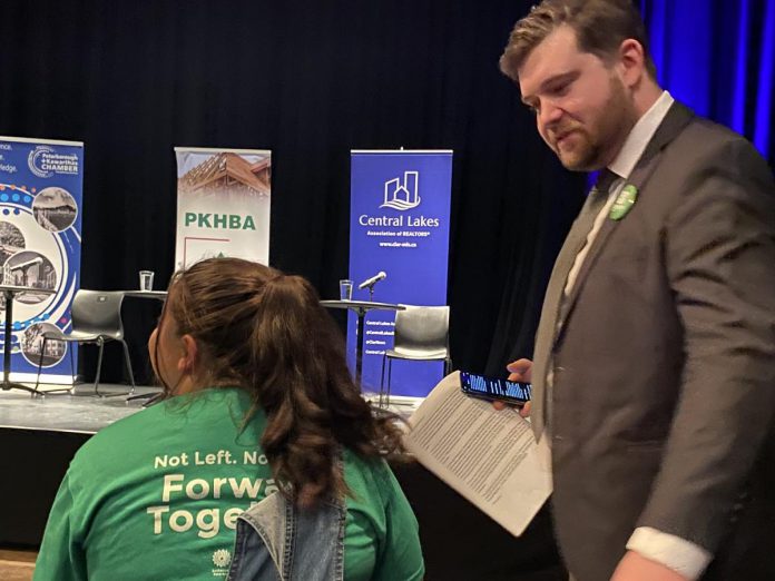 Green Party candidate Lucas Graham chats with a supporter before a debate at Market Hall in downtown Peterborough on February 18, 2025. (Photo: Paul Rellinger / kawarthaNOW)