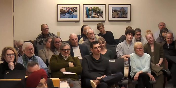 Delegations and members of the public in the gallery during a Peterborough City Council meeting on February 24, 2025. (kawarthaNOW screenshot of City of Peterborough video)