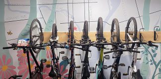 Wall hooks offer an efficient use of space when storing multiple bikes at once indoors, which are great for schools, offices, or camps. Picture above, Urban Bike Adventure campers hang their bikes in a space-conscious and attractive way in the GreenUP office in downtown Peterborough. (Photo: Natalie Stephenson / GreenUP)