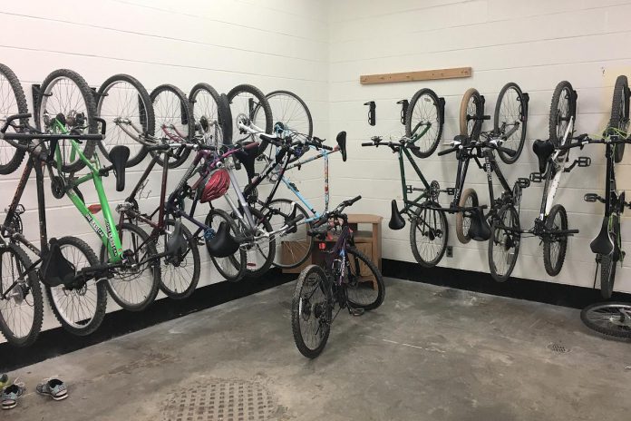 Wall hooks installed at Thomas A. Stewart Secondary School allow for efficient storage of bicycles, making an active commute to and from school more accessible to students. (Photo: GreenUP)