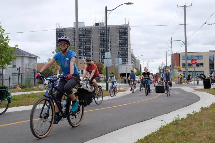 Cyclists make their way down the newly opened Bethune Street bicycle priority street in 2023. The summer of 2023 saw the unveiling of the Peterborough's first purpose-built bicycle priority street on Bethune from McDonnel to Townsend. This transformation was part of a larger project to redevelop the culverts under the street to prevent flooding, which can now be enjoyed by commuters and families alike, whether off to work or on a leisurely ride. (Photo: Lili Paradi)