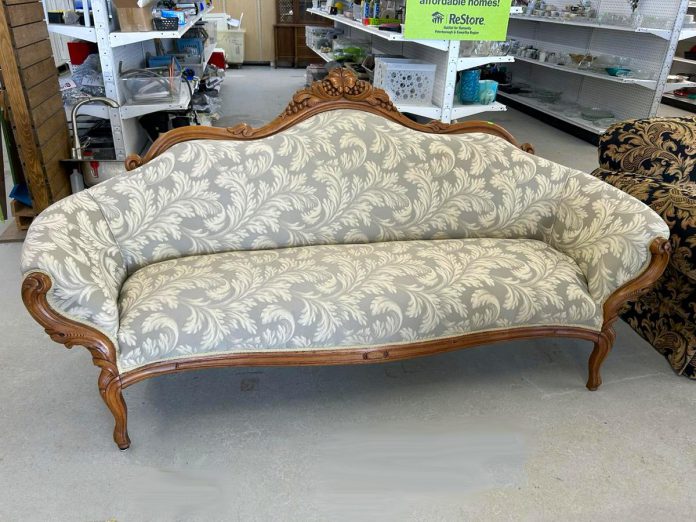 Habitat for Humanity Peterborough & Kawartha Region is transforming its Lakefield ReStore into a boutique-style store specializing in antiques, vintage treasures, and one-of-a-kind specialty items, such as this antique settee sofa that recently sold for $195. The Lakefield ReStore is also now the only ReStore in the region open on Sundays. (Photo: Lakefield ReStore / Facebook)