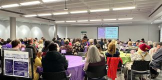 Community members at the Peterborough Public Library for the 2024 International Women's Day community event organized by the Kawartha World Issues Centre and the Kawartha Sexual Assault Centre. This year's free community event takes place from 12:30 to 4:30 p.m. at the library, following a rally and march that begins at 11:30 a.m. at Peterborough City Hall. The community event will include speakers, panellists, resources, performances, a kids' corner, and more. (Photo courtesy of Kawartha World Issues Centre)