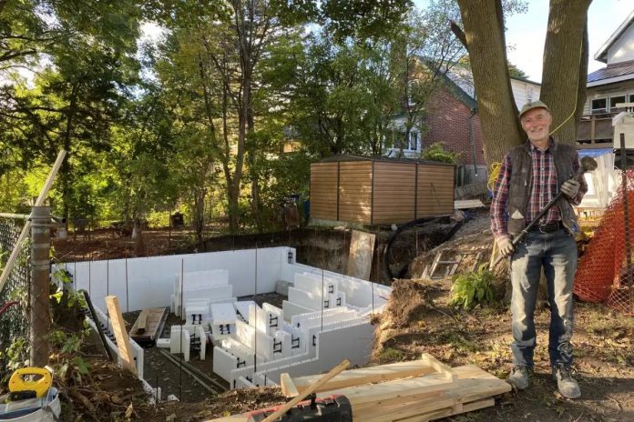 PATH's Keith Dalton working on the site of the new tiny home located in the backyard of an existing west-end property owned by One City Peterborough in 2024. (Photo: PATH)