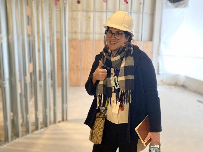 Peterborough Community Health Centre executive director Ashley Safar gives a thumbs up as she reviews the progress of construction of the centre's new longer-term location on two floors of Peterborough Square mall, where the centre is currently operating out of a temporary location. (Photo: Peterborough Community Health Centre)